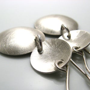 Image of inside out disks. earrings. sterling silver.