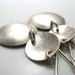 Image of inside out disks. earrings. sterling silver.