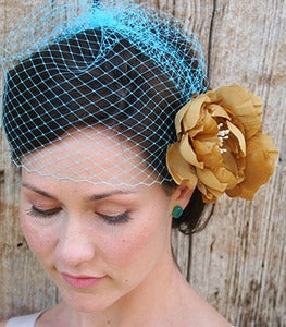 Image of Josephine II - Simple Birdcage Veil in Turquoise paired with double golden yellow silk flower