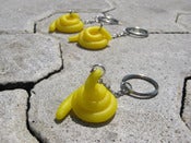 Image of "yellow poo" key holder