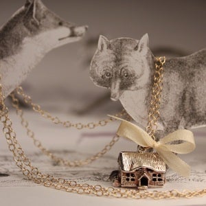 Image of house with gold chain
