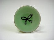 Image of Bow saucer tie pin