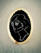 Image of Gypsy Skull Tattoo - white and black on a scalloped plaque