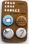 Image of four crap badges