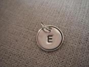 Image of Initial  1/2 With Circle and Smaller Cap