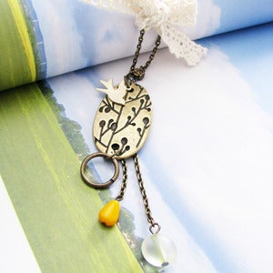 Image of flying over fields of blossoms necklace