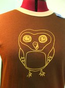 Image of brown unisex small ringer tee with gold owl 70's classic cut! 