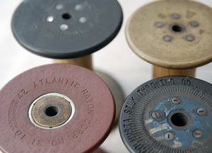 Image of Four Wooden Vintage Bobbins with Fibre Ends