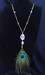 Image of Long rutilated quartz & peacock