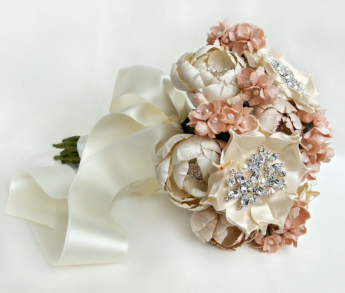 This silk fabric bridal bouquet is comprised of hand cut and formed flowers