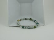 Image of Aquamarine trimmed out in gold