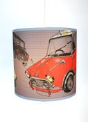 Image of 10" Tube Shade with mini's on a grey background with red check pattern