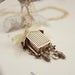 Image of vintage cuckoo clock with gold chain 