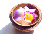 Image of Hand Carved Soap Flower in Wooden surround.