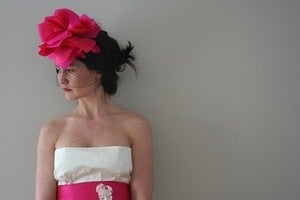 Image of Pink Lia silk flower headpiece paired with black birdcage veil
