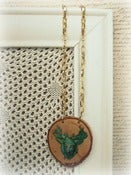 Image of Patina Deer Head Necklace on Wood Slice