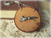 Image of Silver Fox Necklace on Wood Slice