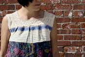 Image of cream lace with woven blue and floral dress