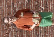 Image of burnt orange unisex hoodie with soft flannel in hood and on pockets