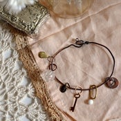Image of knitter's charm. hammered copper bracelet by bricolage studios.
