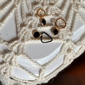 Image of knitter's charm. 'facette' stitch marker charms.