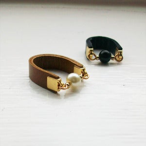 Image of dot rings - black, tan, red