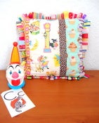 Image of ribbon edged cushion