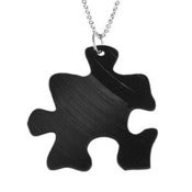 Image of Puzzle Necklace/Earrings made from a recycled vinyl record.
