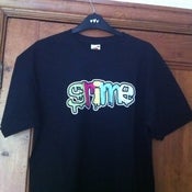 Image of Colour Grime Logo on different colour T Shirts - Men and Women's