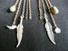 Image of metal feathers & fetish earrings