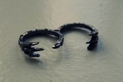 Image of double finger talon ring.