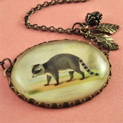 Image of The Raccoon - Bronze Bubble Necklace with Leaf and Pinecone Accents