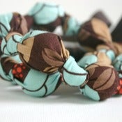 Image of Warm Turquoise Flowers Chomping Necklace