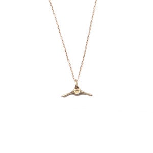 Image of 14k gold tiny caudal vertebrae on 18” fine cable chain (P0714k18)