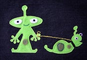Image of Alien Boy and Dog(?)