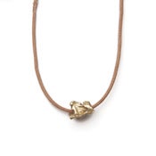 Image of 14k gold single vertebrae on wax-coated cotton w/ 14k gold caudal vertebrae closure (P021B1014k)