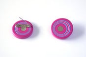 Image of brooch, pink/blue/white