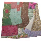 Image of Multi Colored Quilt with Kettle