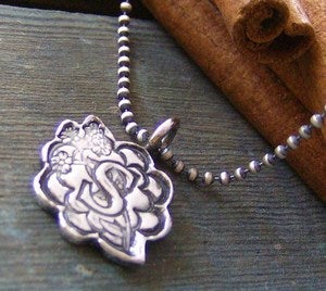 Image of sweet little flowers.... hand stamped floral pattern initial necklace