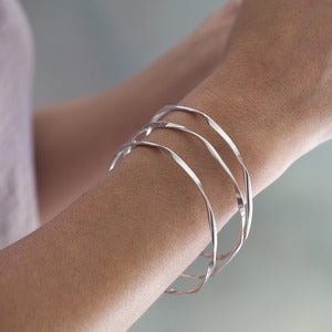 Image of sterling silver ribbon bangles