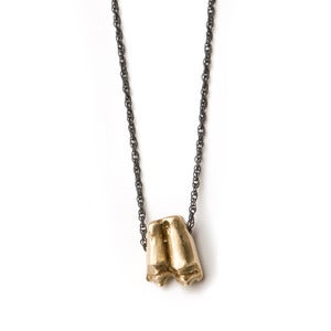 Image of brass sheep tooth on 28" oxidized silver rope chain (P27bra28)