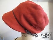 Image of orange hats with tie detail
