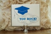 Image of Grad- "You Rock! congratulations" with earbuds