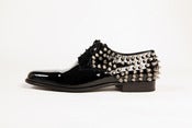 Image of shiny spike shoe