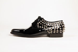 Image of shiny spike shoes