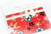 Image of oriental flowers with cream bow anniversary card