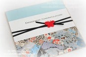 Image of oriental blossoms in blue engagement card