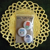 Image of high street commissioned artist button set by suzy ultman.