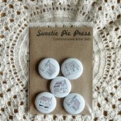 Image of the maple ridge commissioned artist button set by andrew zangerle.
