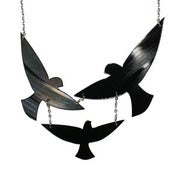 Image of Birds In Flight Necklace made from a recycled vinyl record.
